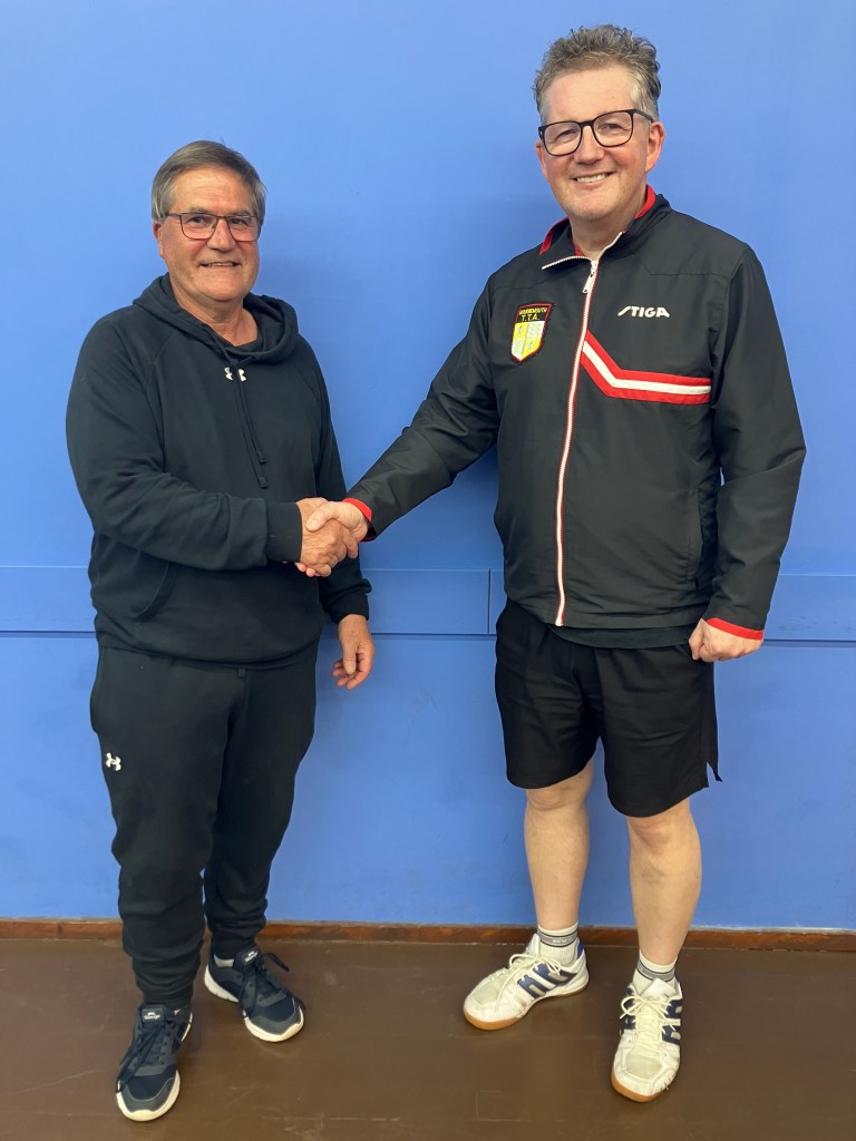 Veterans winner Brian Vibert shaking hands with Ian Johnstone
